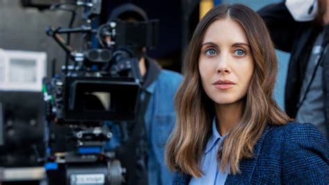 Alison Brie pranking Dave Franco by streaking in the hotel hallway.